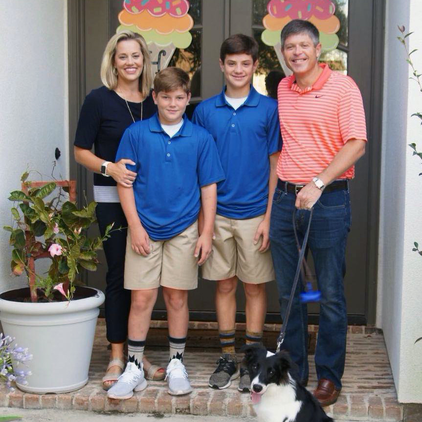 Bobby Hurley and his wife and children